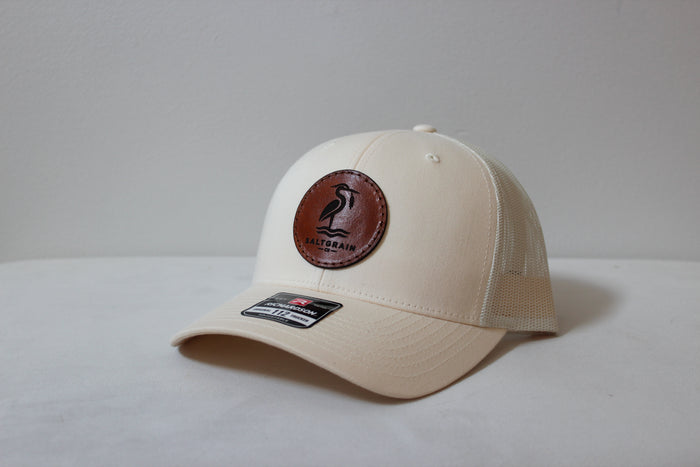 Full-grain leather patch dyed golden brown, sewn with brown nylon thread on a Richardson 112